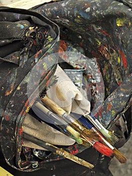 An artistÃ¢â¬â¢s brushes and bag in front of the Pompidou Center photo